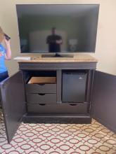 Spacious granite top credenza with a mini fridge that fits inside! 