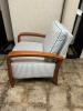 Comfy brown wood armed chair with white cushions