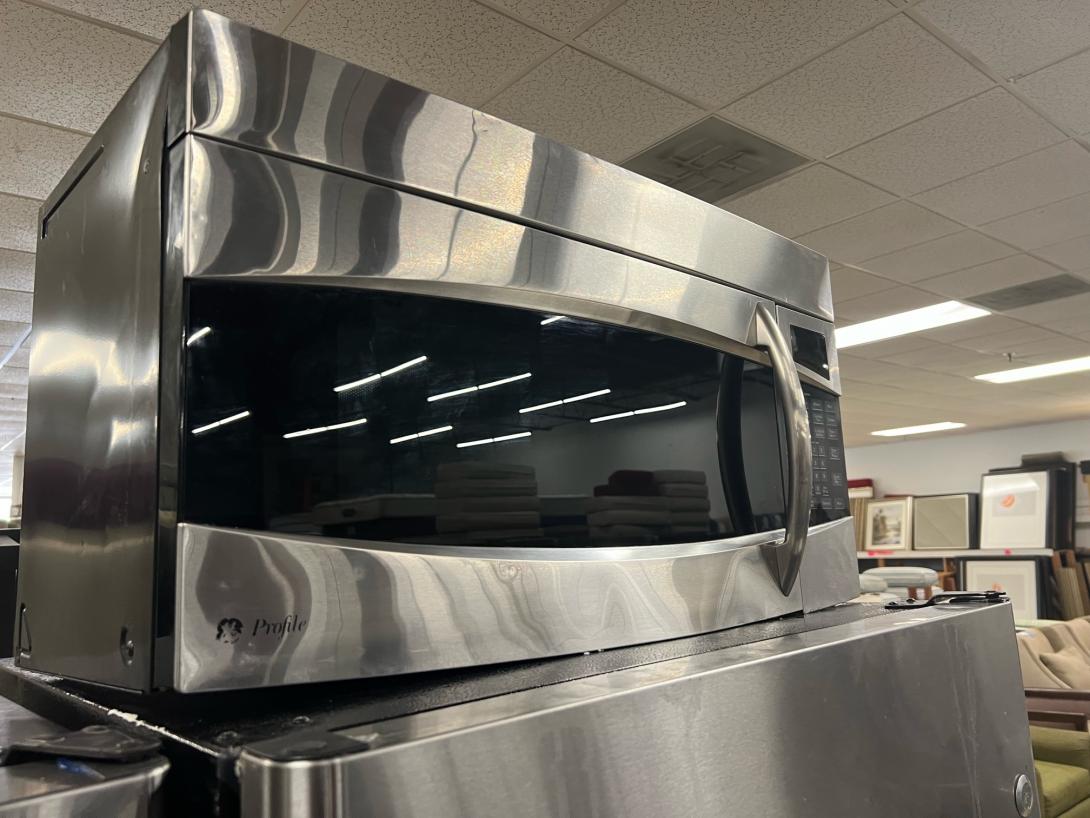 Above the range standard stainless steel GE Profile Microwave. 