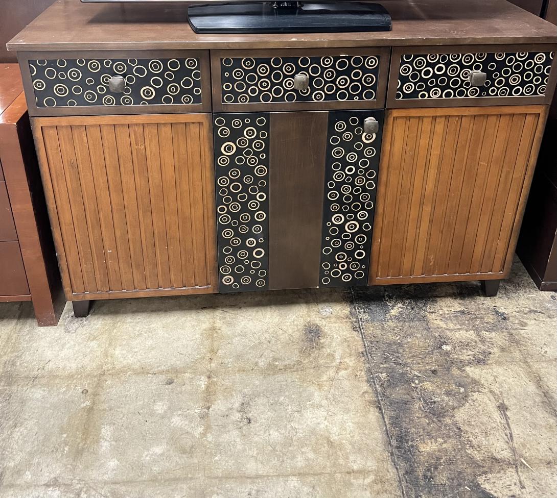 Spacious TV stand with all of the drawers you need! Brown with patterns. 